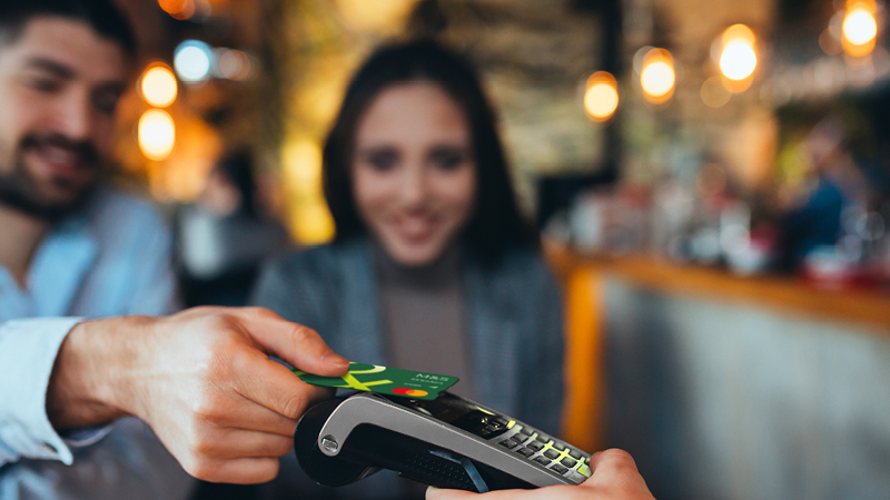 Couple making contactless payment