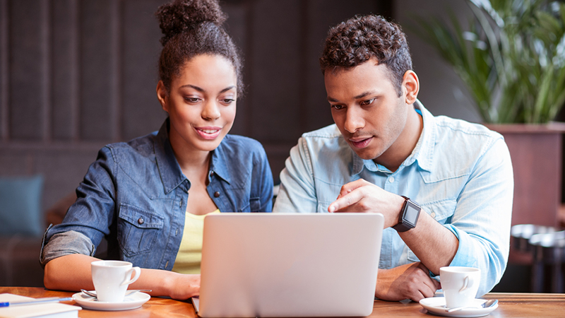 Couple using laptop