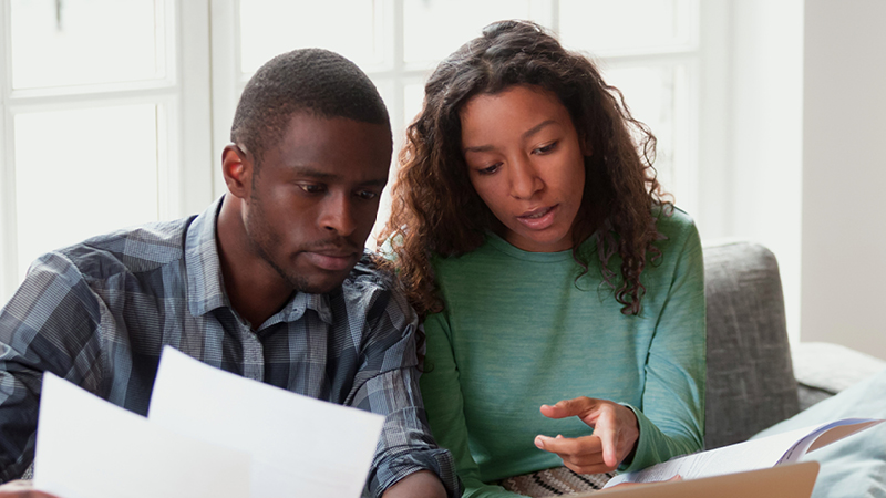 Couple discussing documents