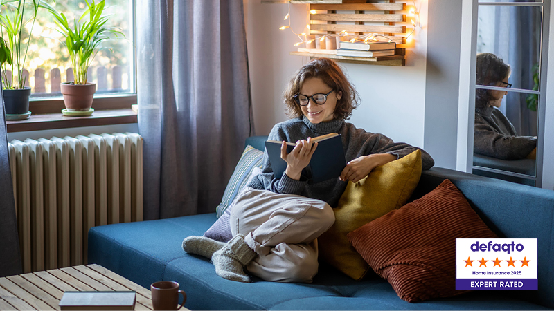 Person reading book on sofa and defaqto five star home insurance 2025 expert rated