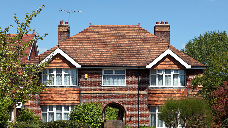 Front of a house showing windows and roof