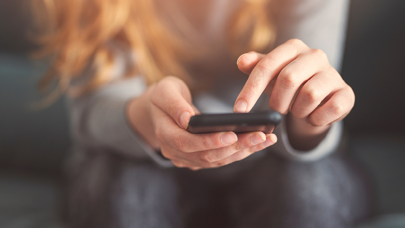 Person holding mobile phone