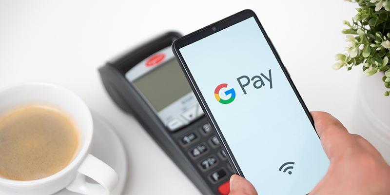 Google Pay phone being held