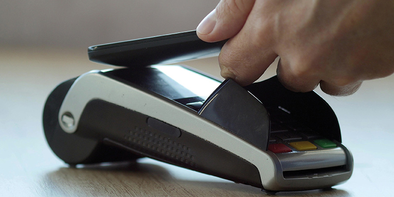 Samsung phone being used to pay at till point