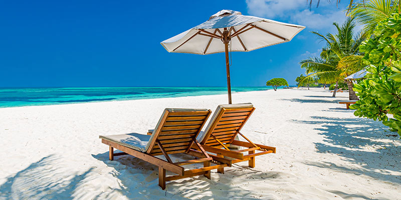 Sunbeds and parasol on a beach