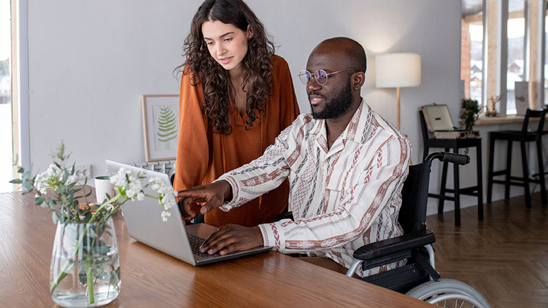 Couple looking at laptop