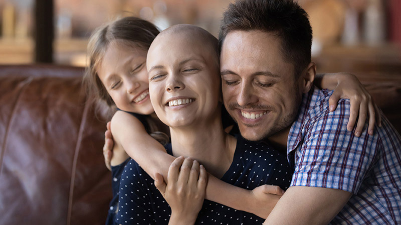 family hugging and smiling